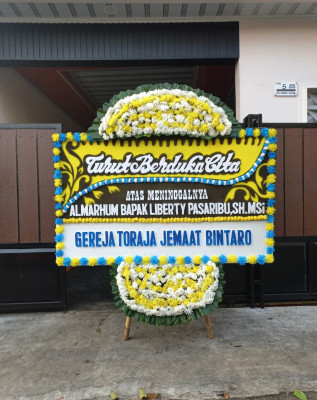 Papan Bunga Duka di Warkar